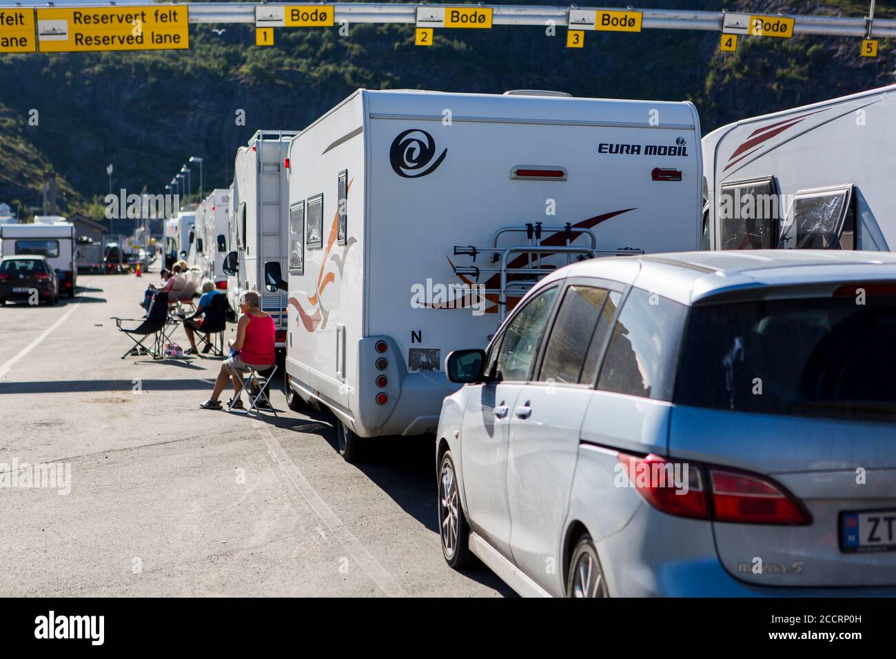 MOSKENES, THE LOFOTEN ISLANDS - JULY 29, 2014: The ferry from Moskenes at Lofoten Islands can be crowdy and people have to wait to get on the ferry to Stock Photo