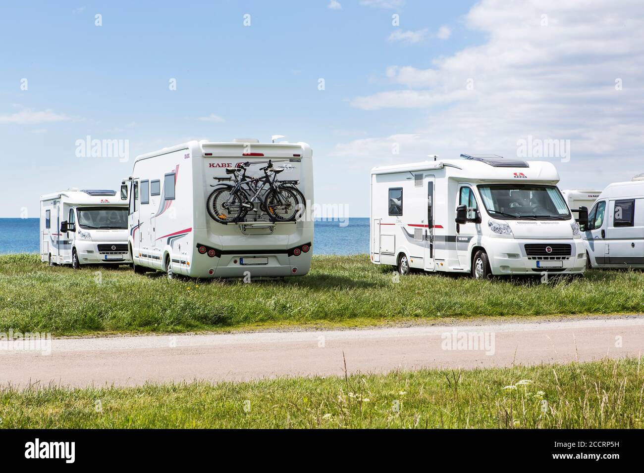 YSTAD, SWEDEN - MAY 29, 2014: The motorhome parking nearby central Ystad, Reningsverket,  is a popular place for tourists to visit. Stock Photo