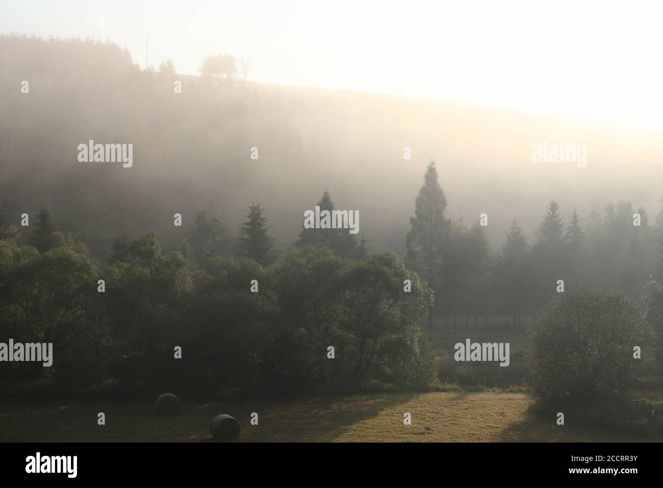 Dawn over the landscape - the sun rising over the countryside Stock Photo