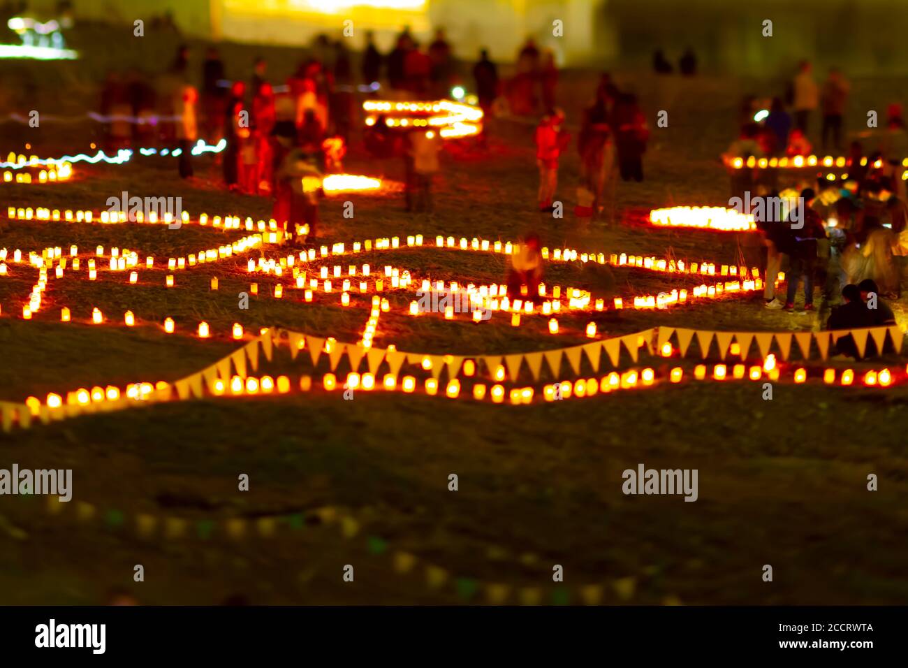A burning romantic candles medium shot tiltshift at dusk Stock Photo
