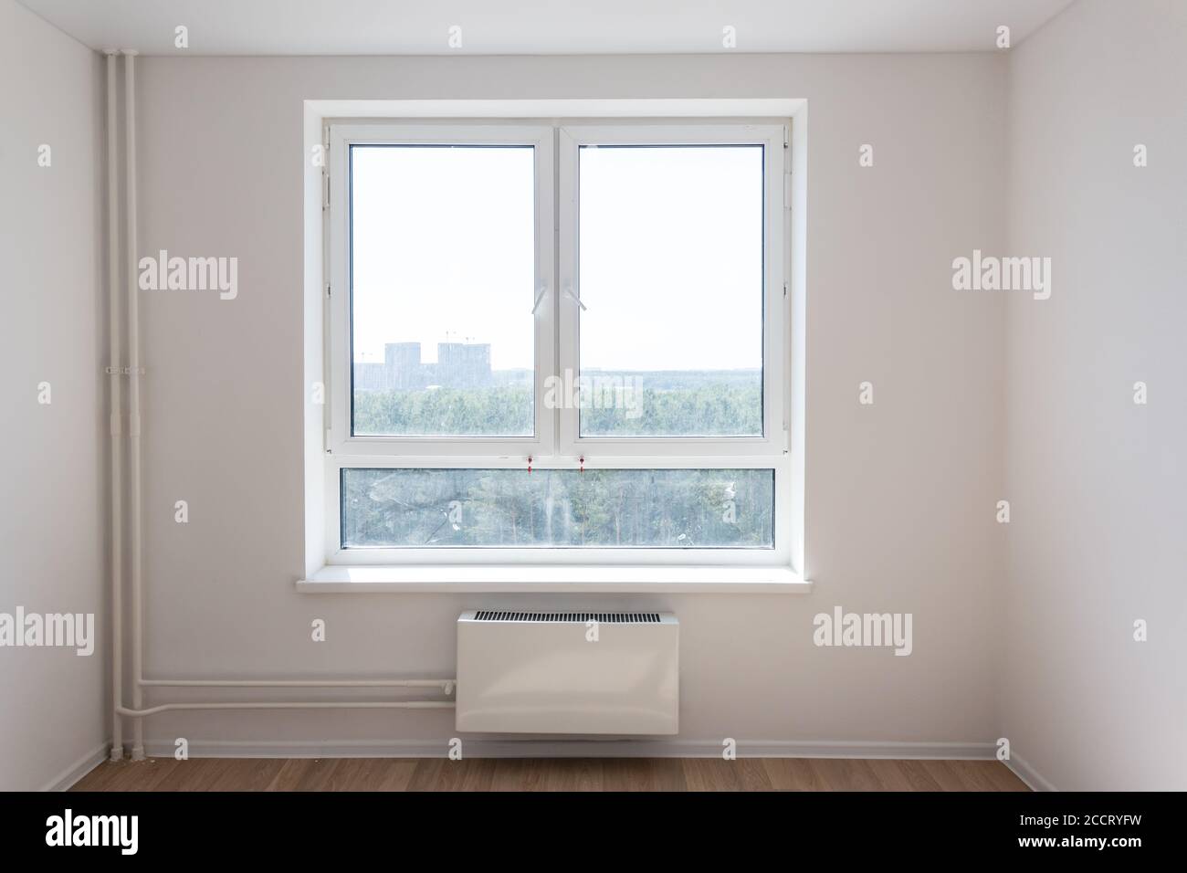 New tubes, radiator and window. Close up image, renovation concept Stock Photo