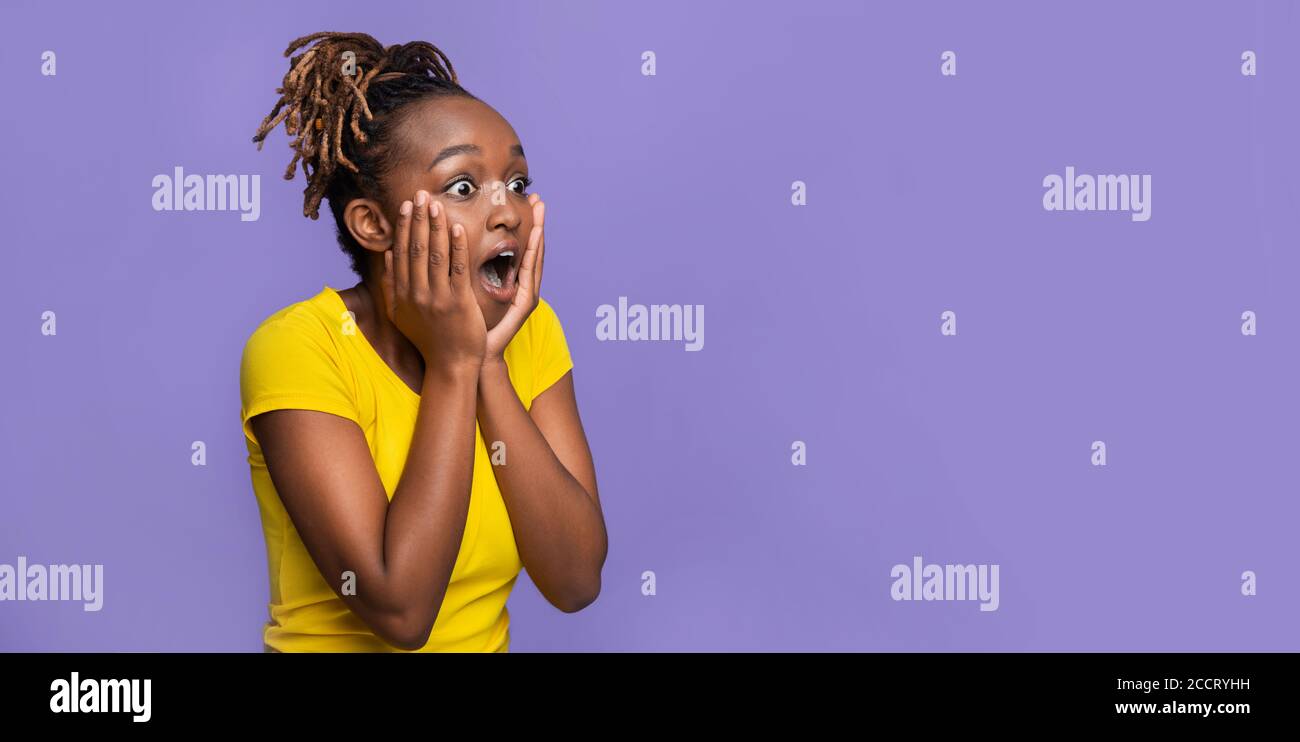 Surprised black woman looking at free space Stock Photo
