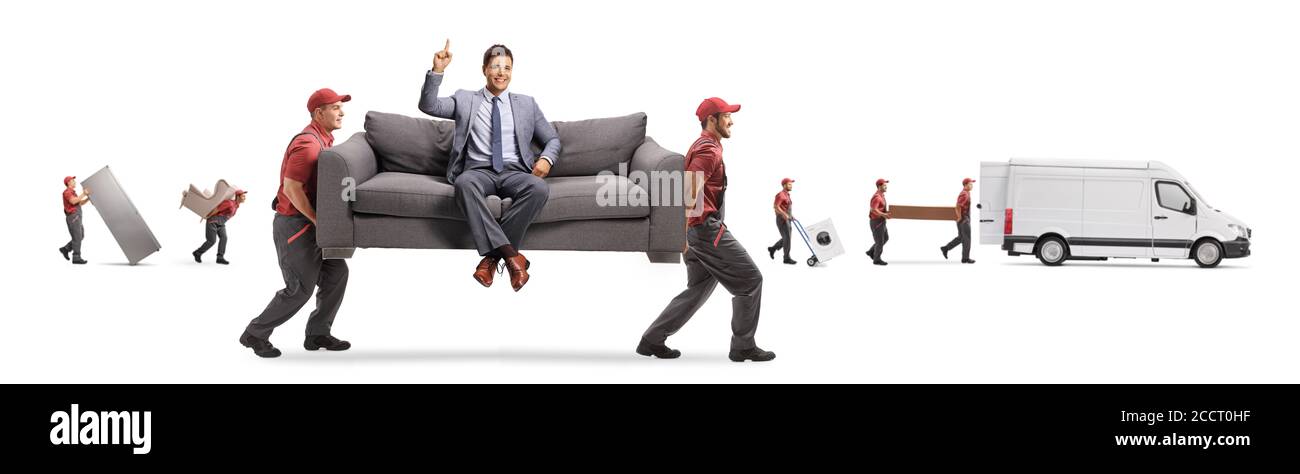 Movers carrying a couch with a man sitting and pointing up and other movers loading a van isolated on white background Stock Photo