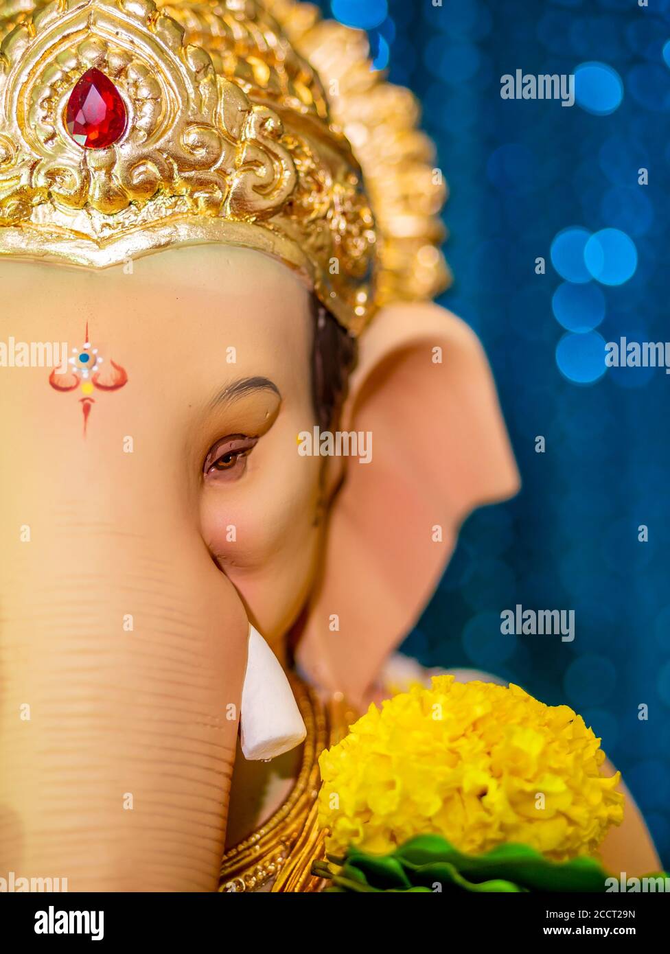 Closed up of Lord Ganesha with blue Bokeh background Stock Photo - Alamy