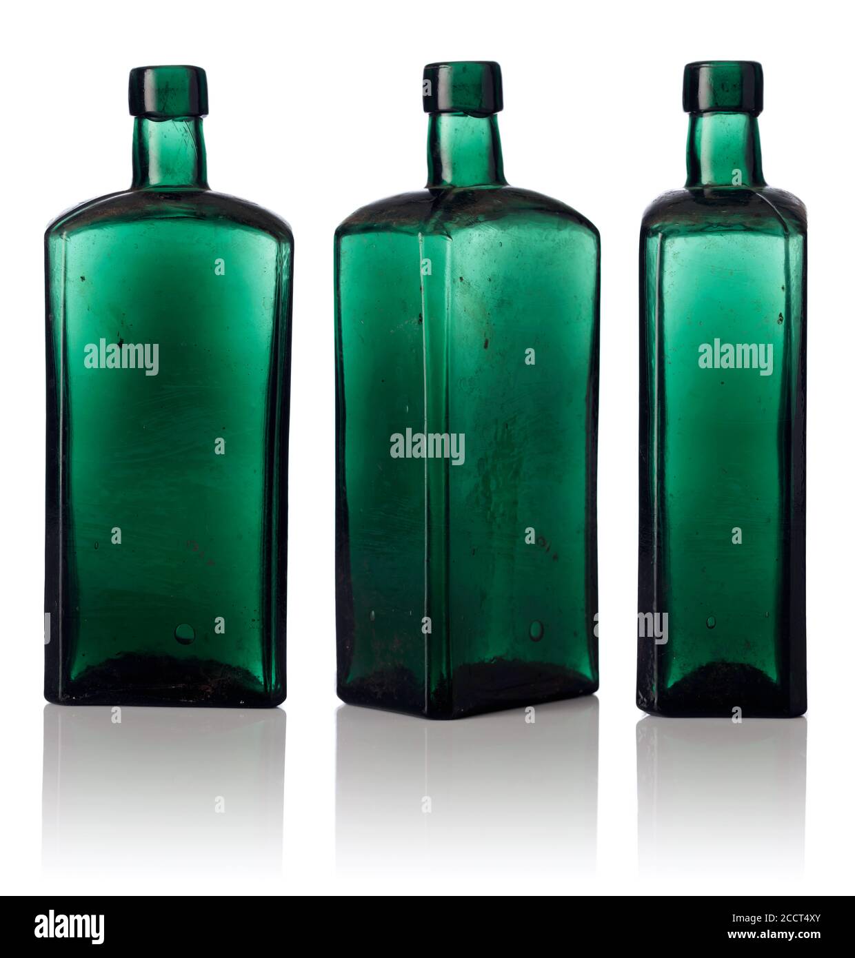 Old empty bottles isolated on a white background. Dusty bottles from color glass Stock Photo Alamy