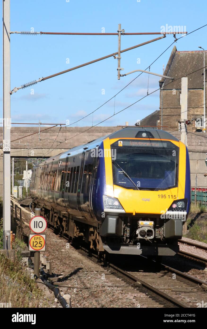 Class 195 CAF Civity dmu, unit number 195115, operated by Northern trains passing through Carnforth on the WCML railway on Monday 24th August 2020. Stock Photo