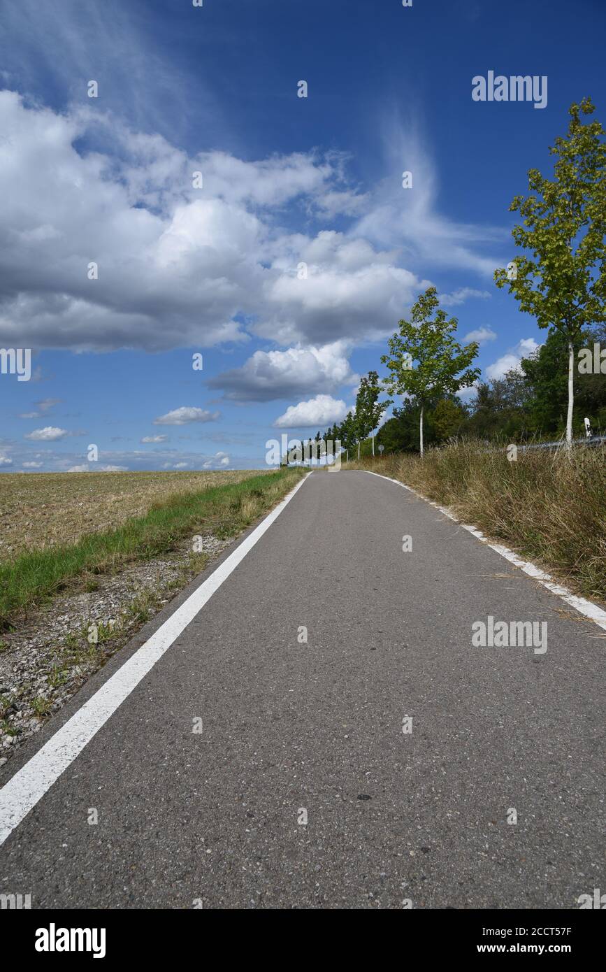 A road leading towards the clouds Stock Photo