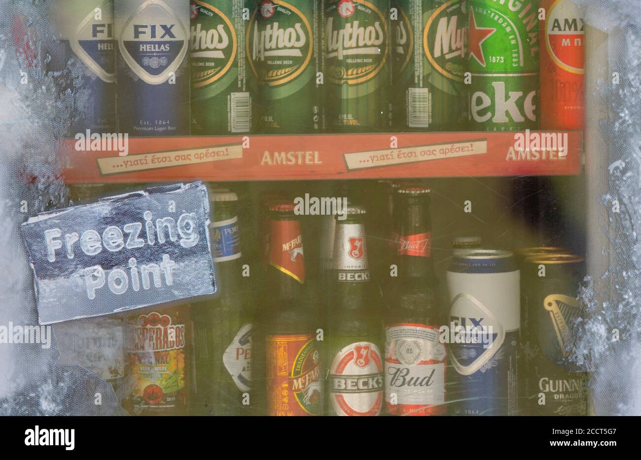 a fridge or refrigeration unit containing ice cold beer with