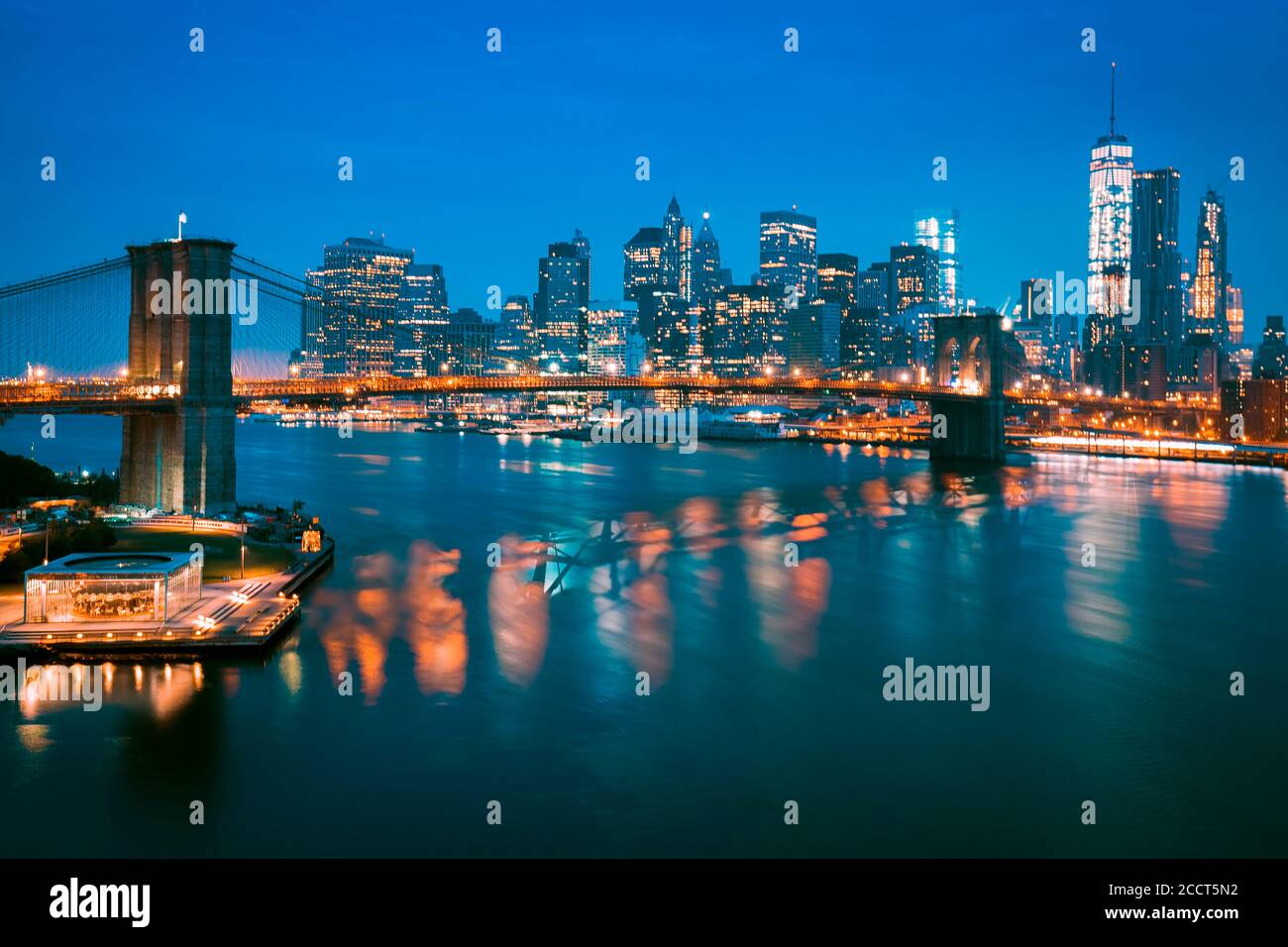 New York City Manhattan midtown at dusk with Brooklyn Bridge. Stock Photo