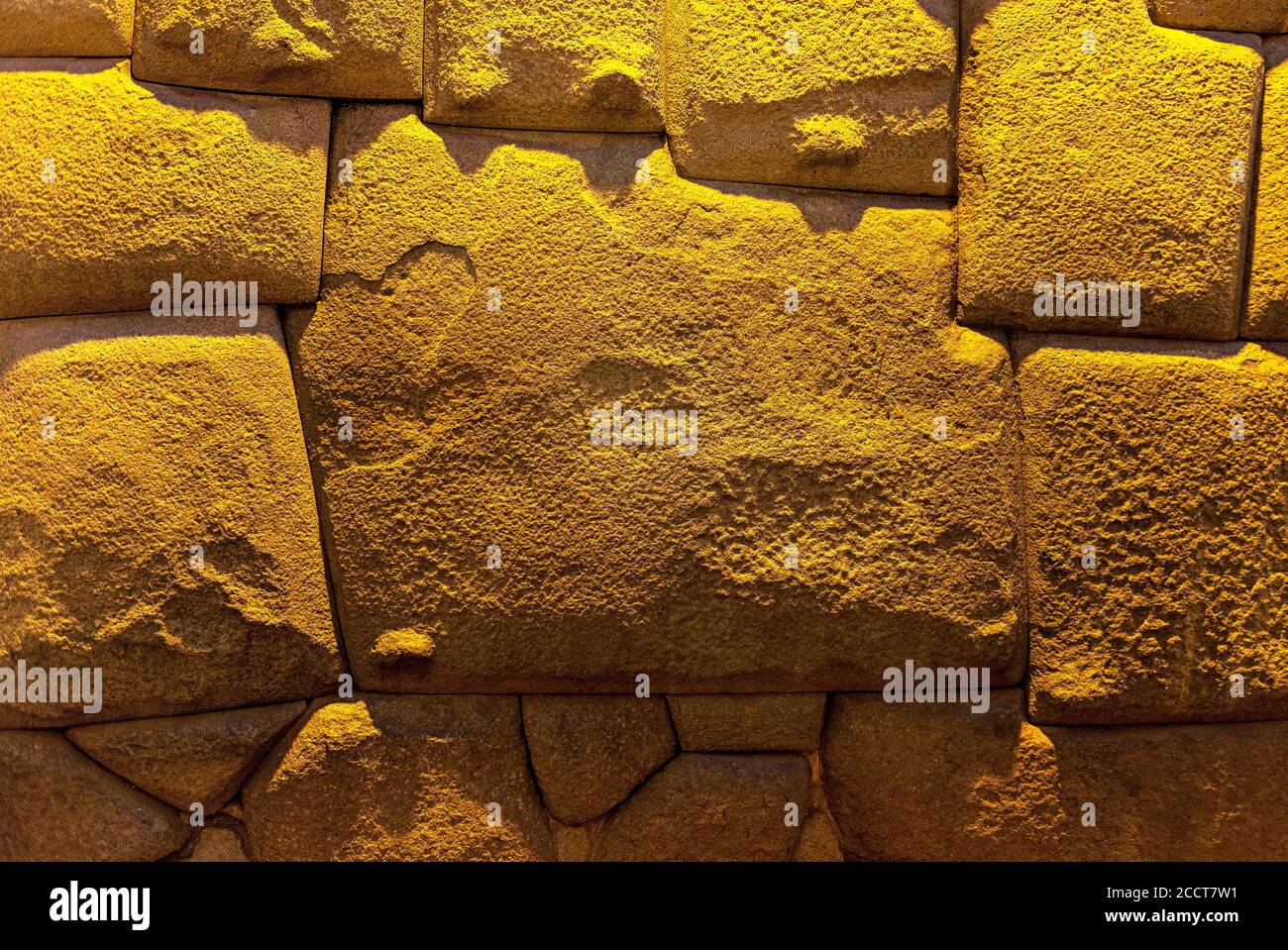 The twelve angle stone at night in the Hatun Rumiyoc street, Cusco, Peru. Stock Photo