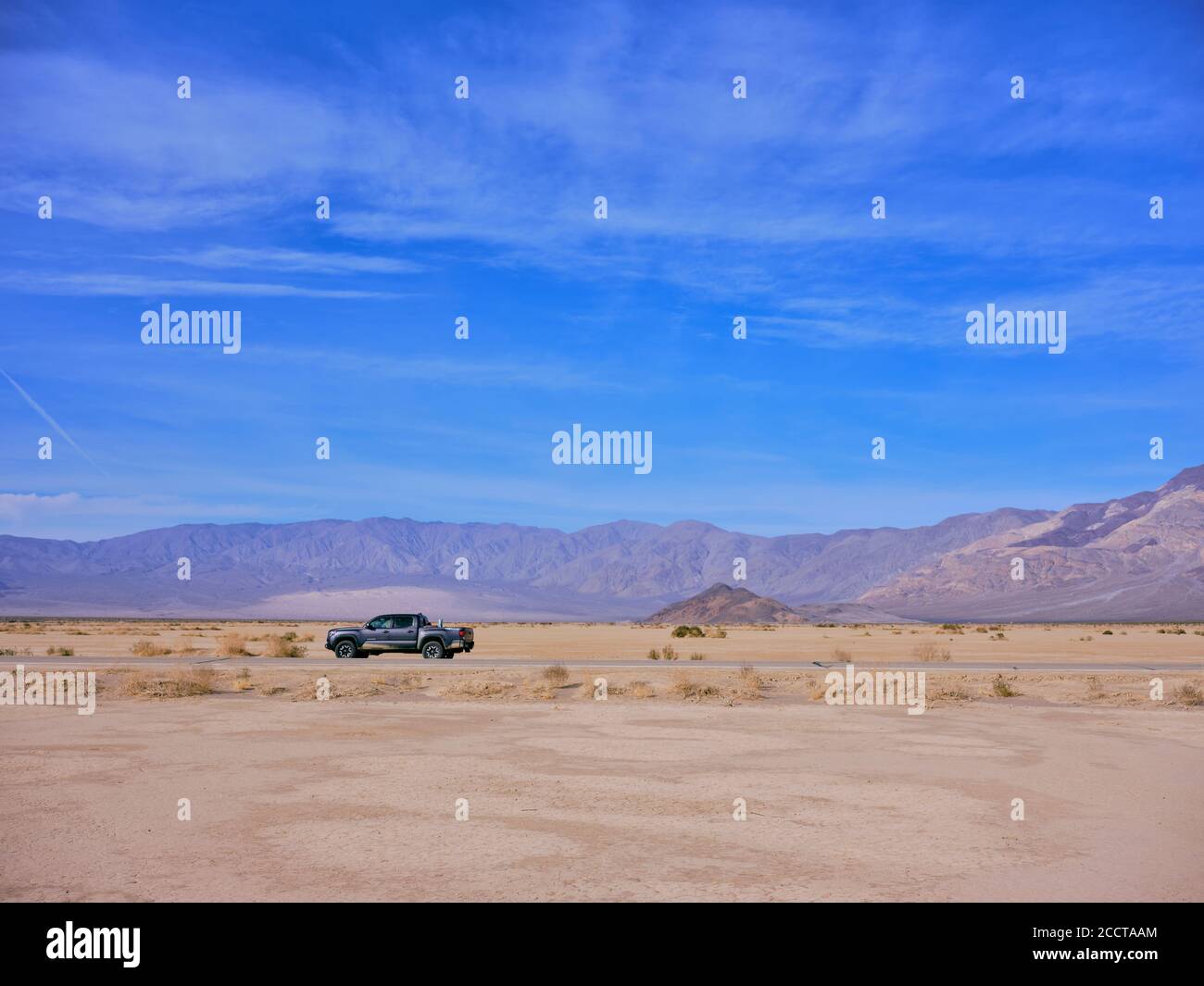 A toyota truck parked on the side of a Death Valley desert highway Stock Photo