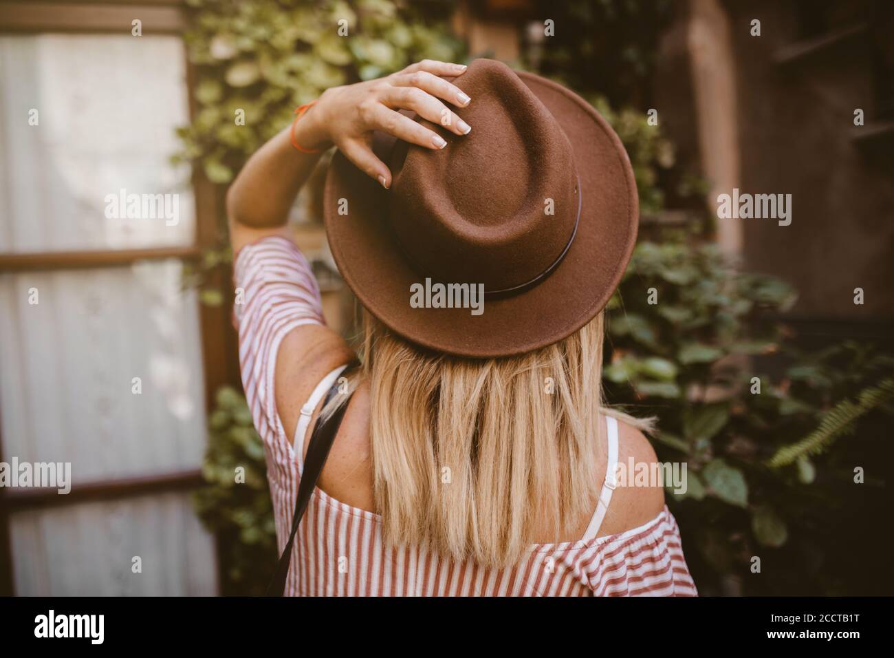 Touching his hat hi-res stock photography and images - Alamy