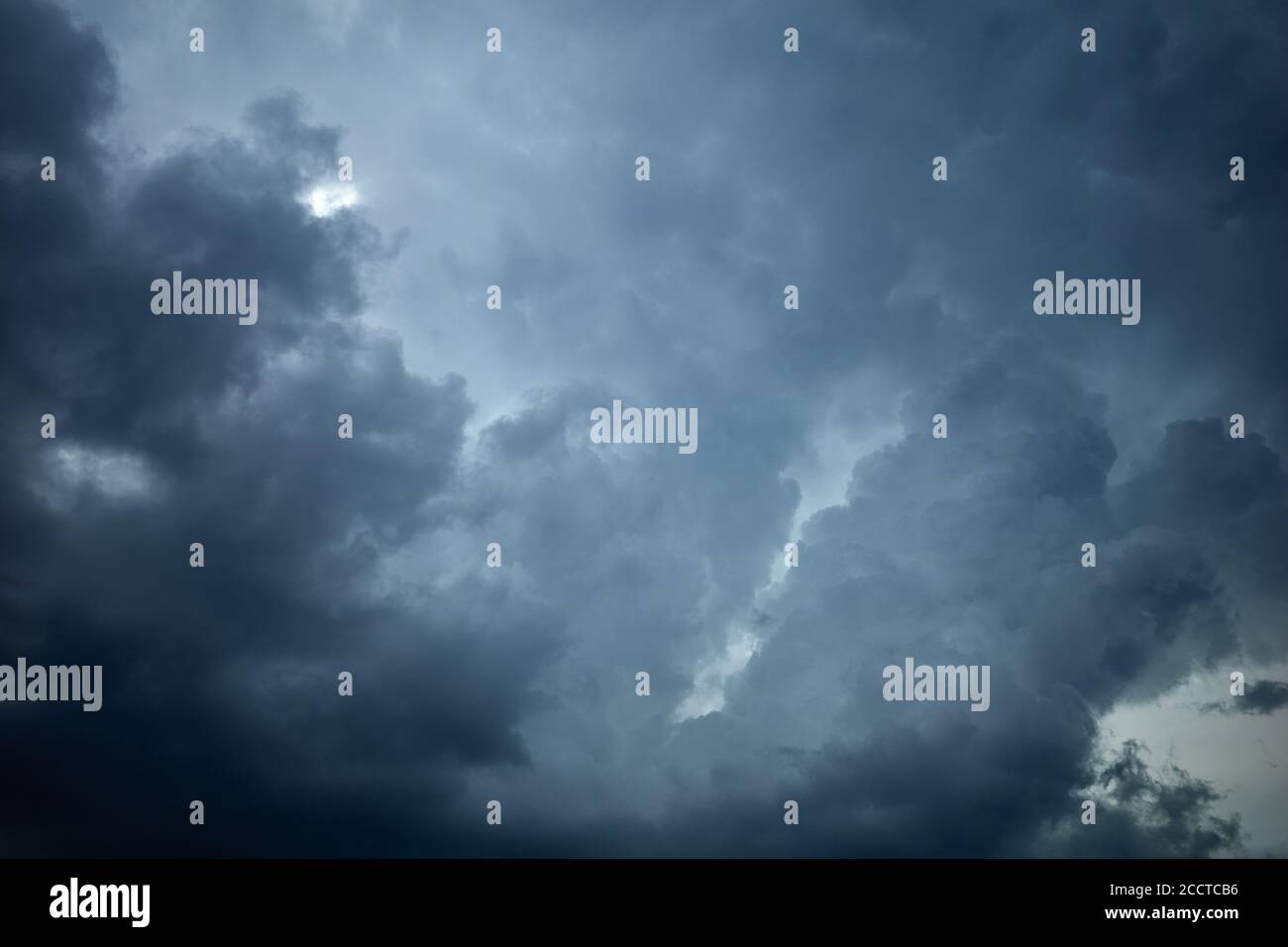 The formation of rain clouds in the lead sky. Overcast sky conditions occur when clouds cover all or most of the sky Stock Photo