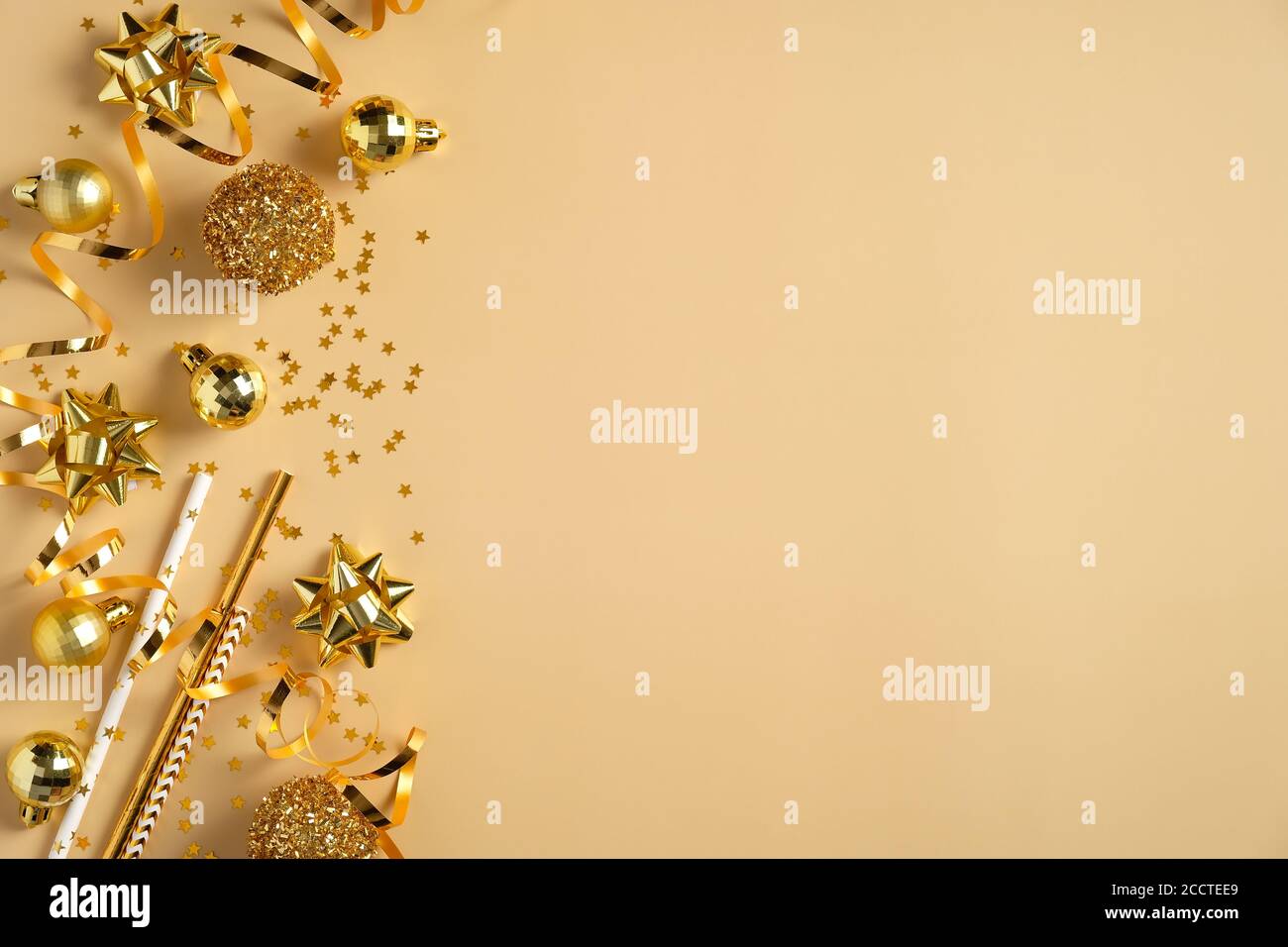 Christmas party invitation card mockup. Flat lay golden Christmas balls,  decorations, tinsel, confetti on yellow background. Top view with copy  space Stock Photo - Alamy