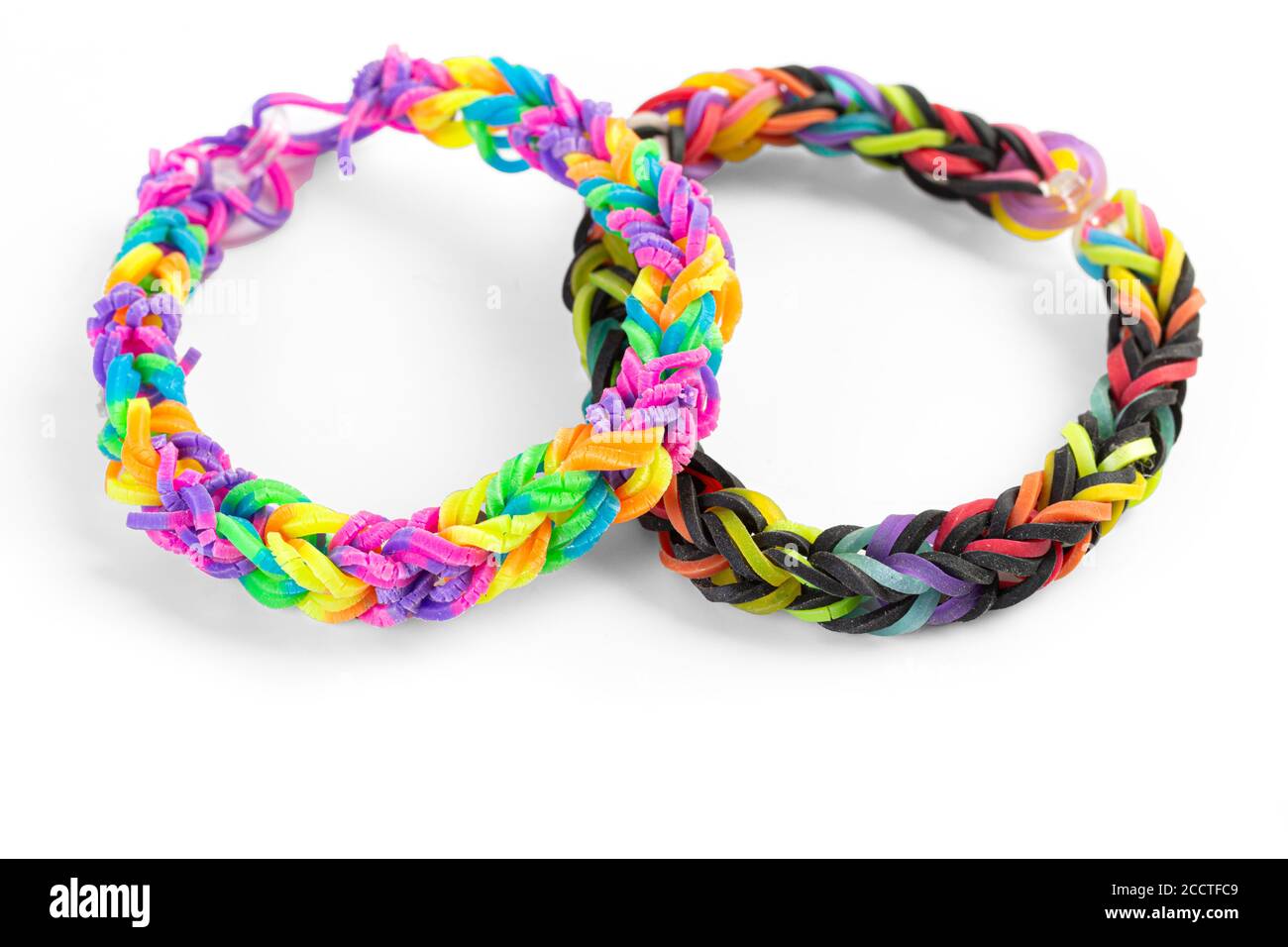 A pair of bracelets made with small rubber bands on white. Stock Photo