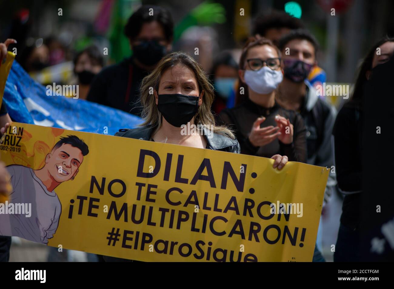 Bogota, Colombia. 23rd Aug, 2020. Alejandra Media, mother of deceased high school student, Dilan Cruz killed by riot police, holds a sign that reads in spanish 'Dilan they didn't silenced you, they multiplied you! the national strike goes on' on August 23 2020 in Bogota, Colombia. Dilan Cruz was a high school student who was shot by a riot police officer during the 2019 national strike in Colombia, on the demonstrations that took place on november 23 2019. (Photo by Sebastian Barros Salamanca/Pacific Press/Sipa USA) Credit: Sipa USA/Alamy Live News Stock Photo