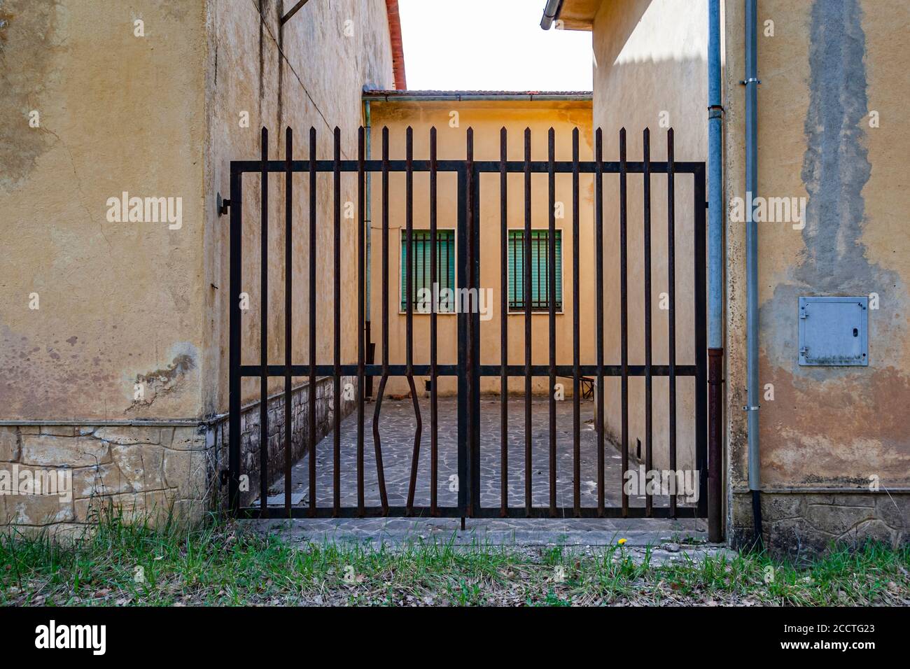 Lattice gate with opening for own dog. Unione dei Comuni Amiata Val d'Orcia, Italy Stock Photo