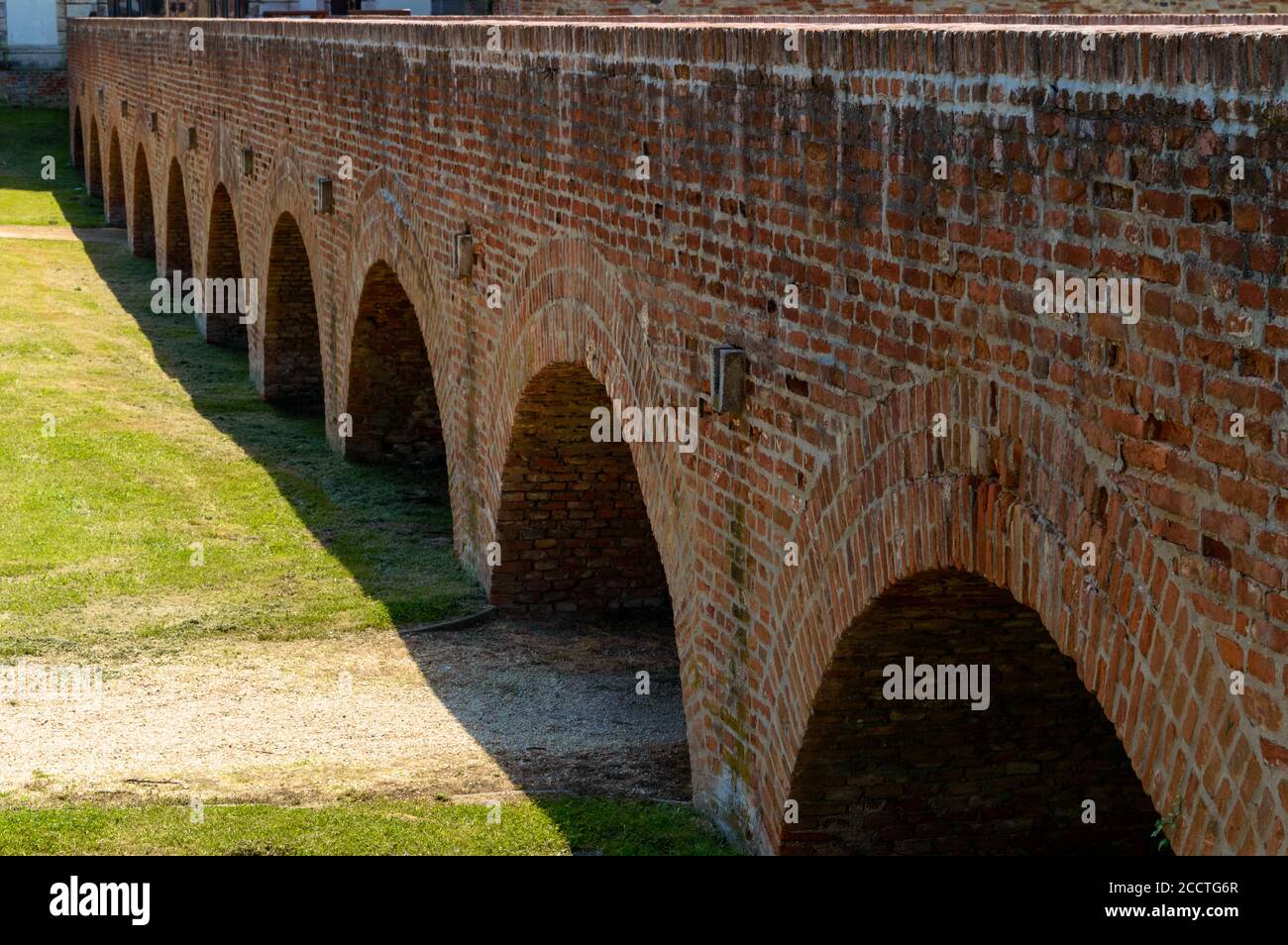 Arcs of the brick bridge of Nadasdy castle (Sarvar, Hungary). Summer colors and sunny weather. Stock Photo