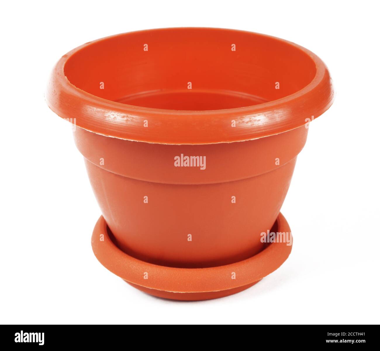 Empty brown plastic flower pot on white background, isolate, close-up Stock Photo