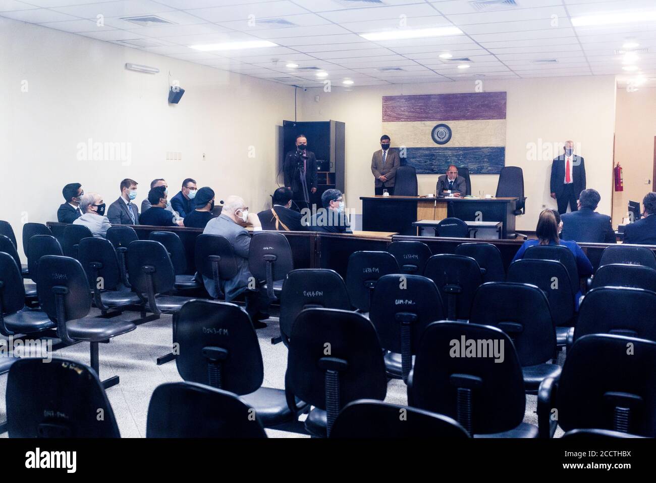 Asuncion, Paraguay. 24th Aug, 2020. The former Brazilian football star Ronaldinho (M.) and his brother Roberto de Assis Moreira (M., l) are sitting in court. The two-time world footballer and 2002 World Champion and his brother were caught with false Paraguayan identity documents shortly after their entry into Paraguay in March and spent more than 30 days in prison. Credit: Jorge Candia/dpa/Alamy Live News Stock Photo