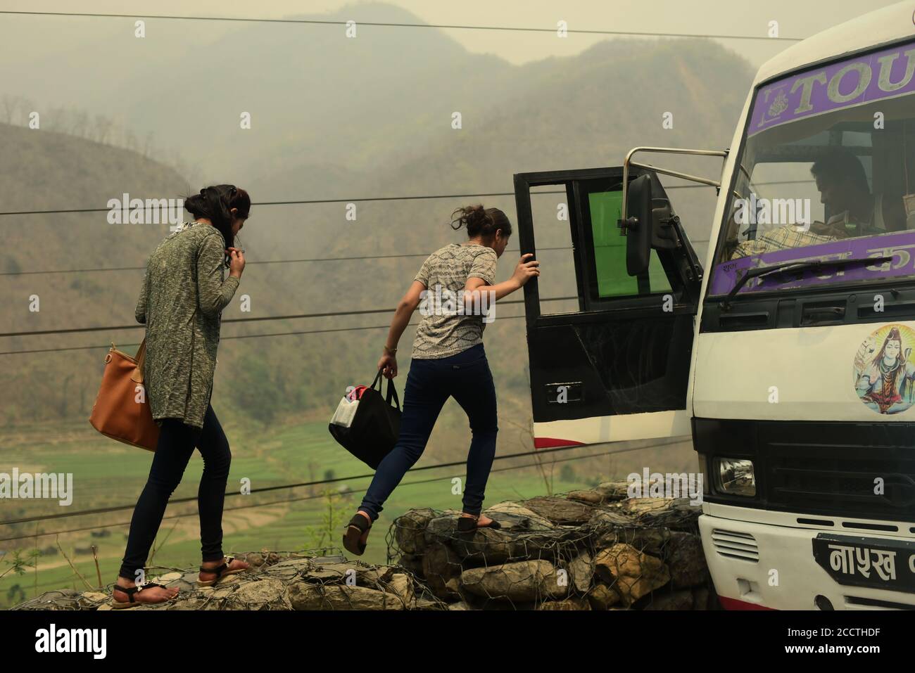 Women boarding bus on a road connecting Pokhara and Kathmandu. Gandaki