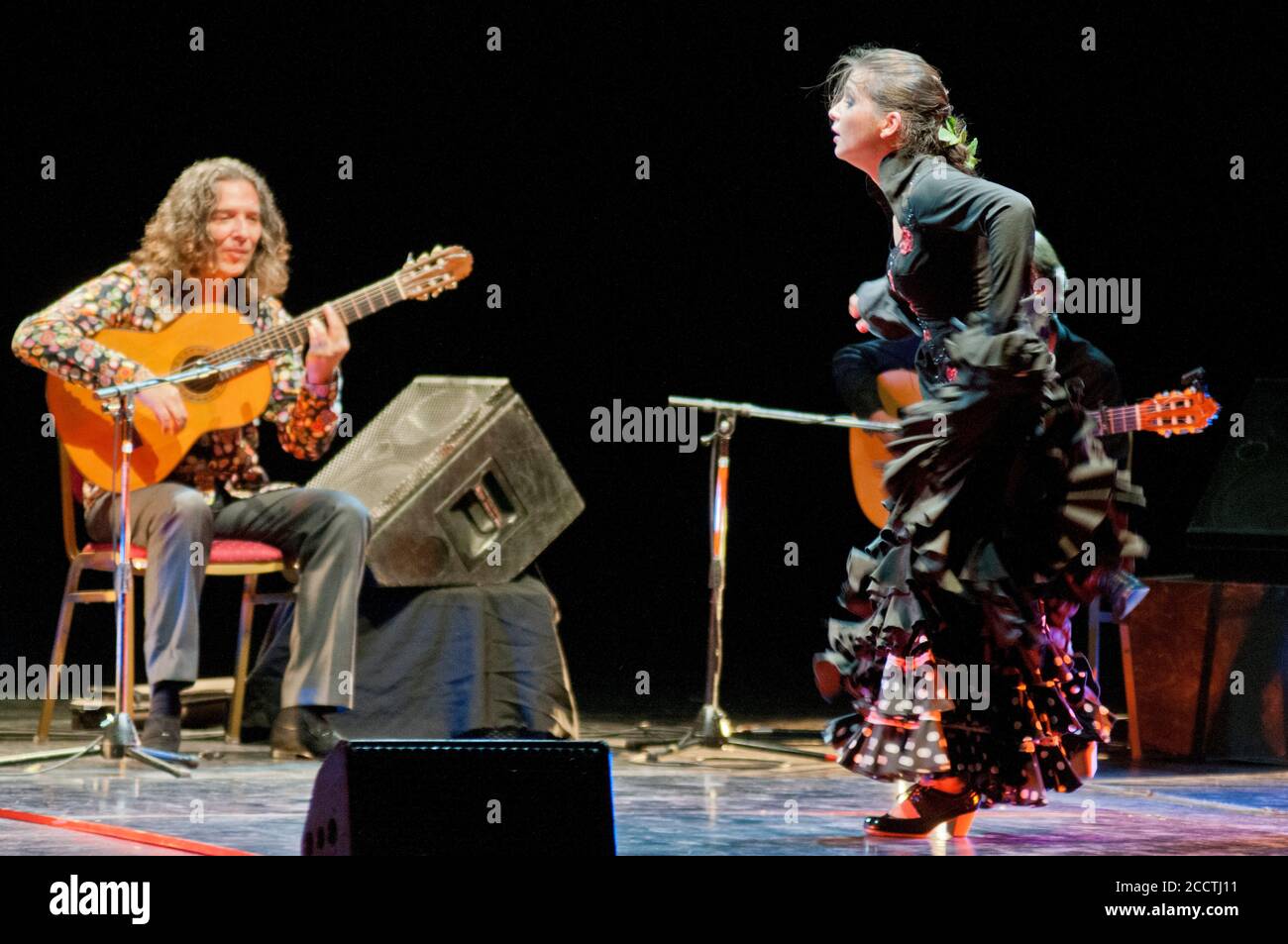 Tomatito, Spanish flamenco guitarist, with female dancer on stage Stock Photo