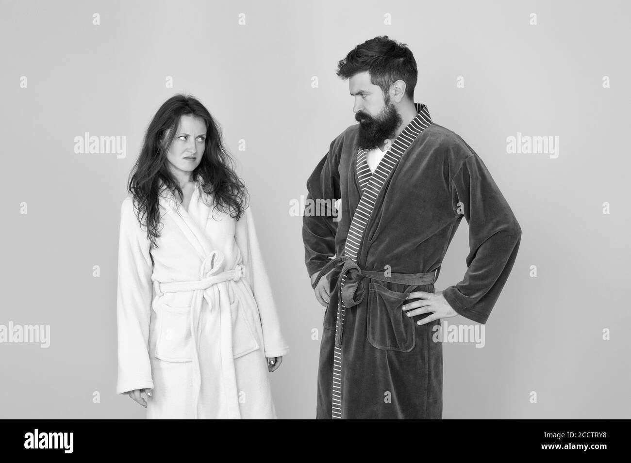 Being sad is a choice. Couple in love look sad. Sad woman and man wear bathrobes blue background. Family conflict. Depression and stress. Bedtime or morning routine. Health care. Unhappy and sad. Stock Photo