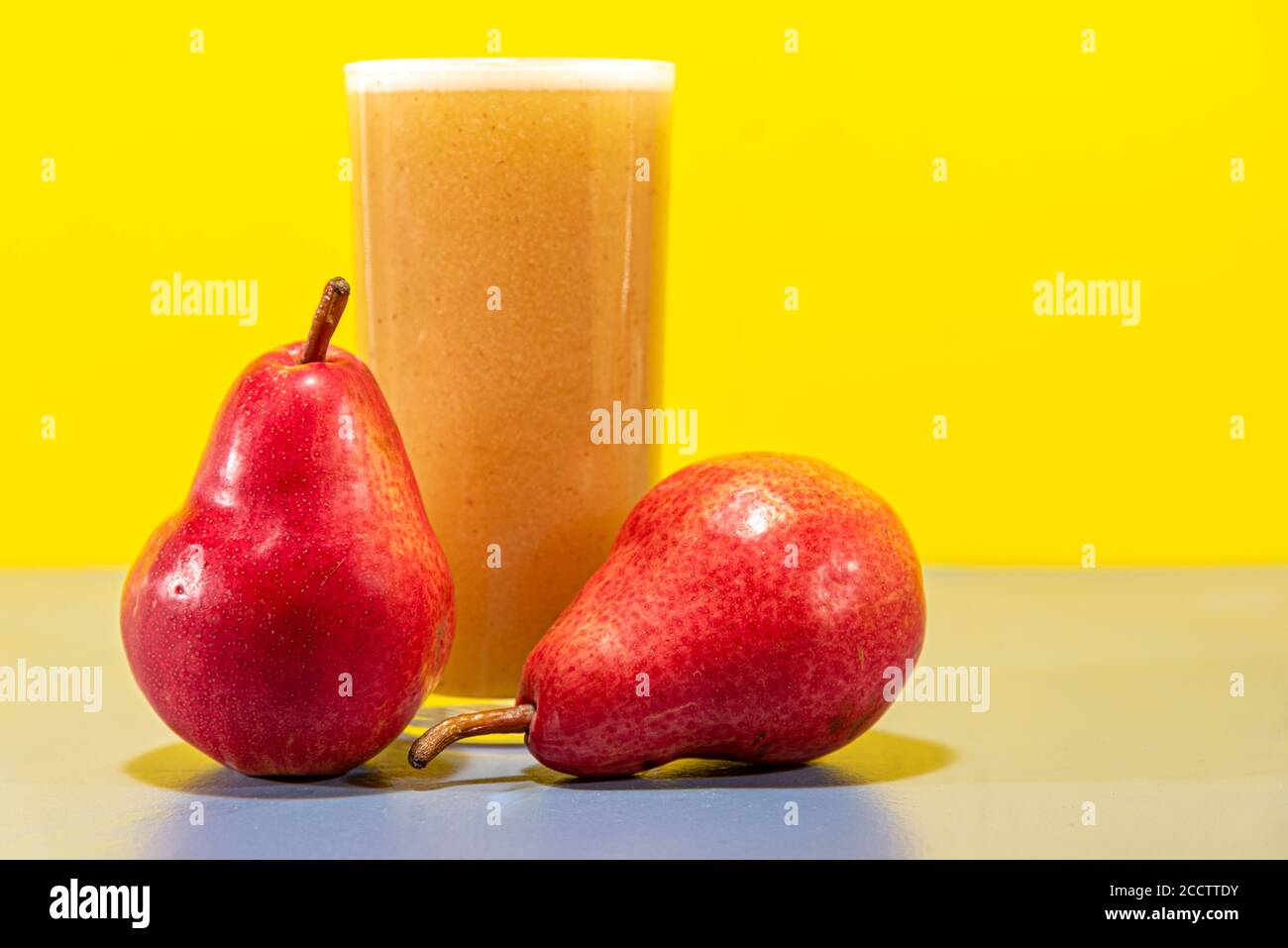 Red Pear Juice. Natural drink. Fruit drink. Fruit from the USA and Canada. Red Pear, also known as Red Williams or Red Barlett. It presents a dark red Stock Photo