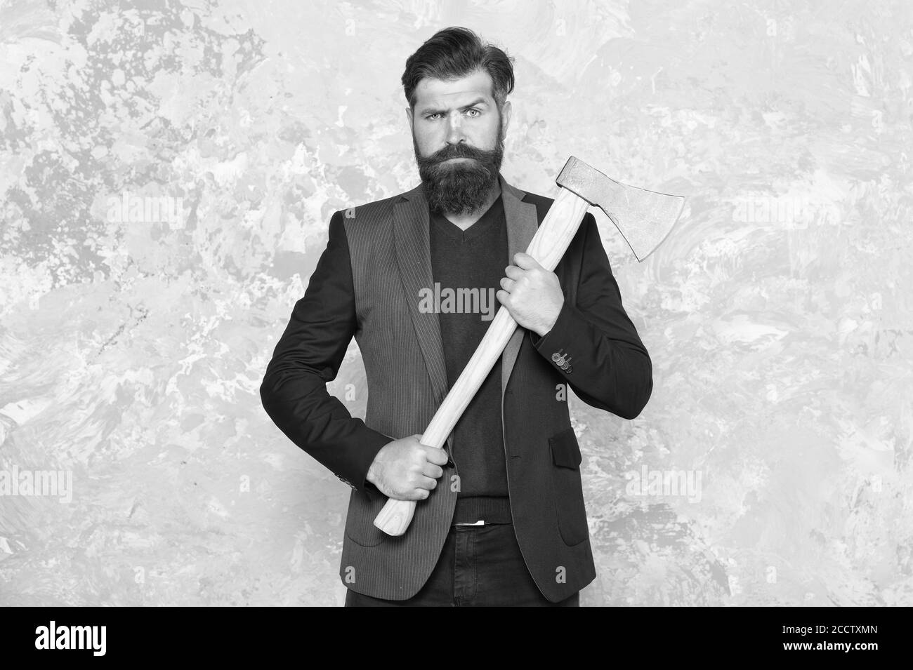 Keep the wild in you. Bearded man hold axe abstract background. Brutal