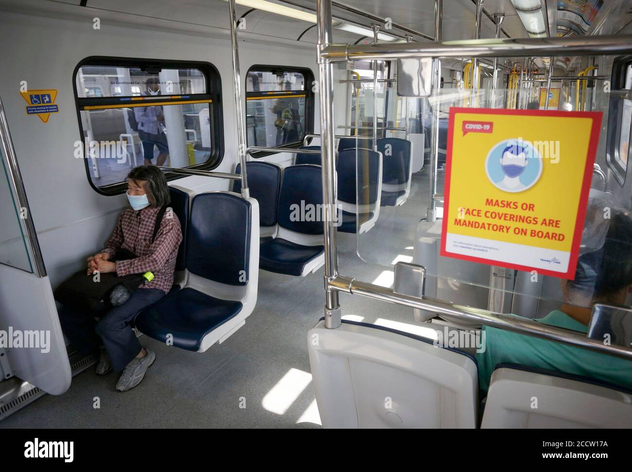 Vancouver, Canada. 24th Aug, 2020. A sign is seen inside a SkyTrain compartment to remind people of wearing face masks in Vancouver, British Columbia, Canada, on Aug. 24, 2020. Anyone on board a TransLink or British Columbia (BC) Transit bus, boat or train and passengers on board BC Ferries vessels are required to wear a face mask beginning Monday to help stop the spread of COVID-19. Credit: Liang Sen/Xinhua/Alamy Live News Stock Photo