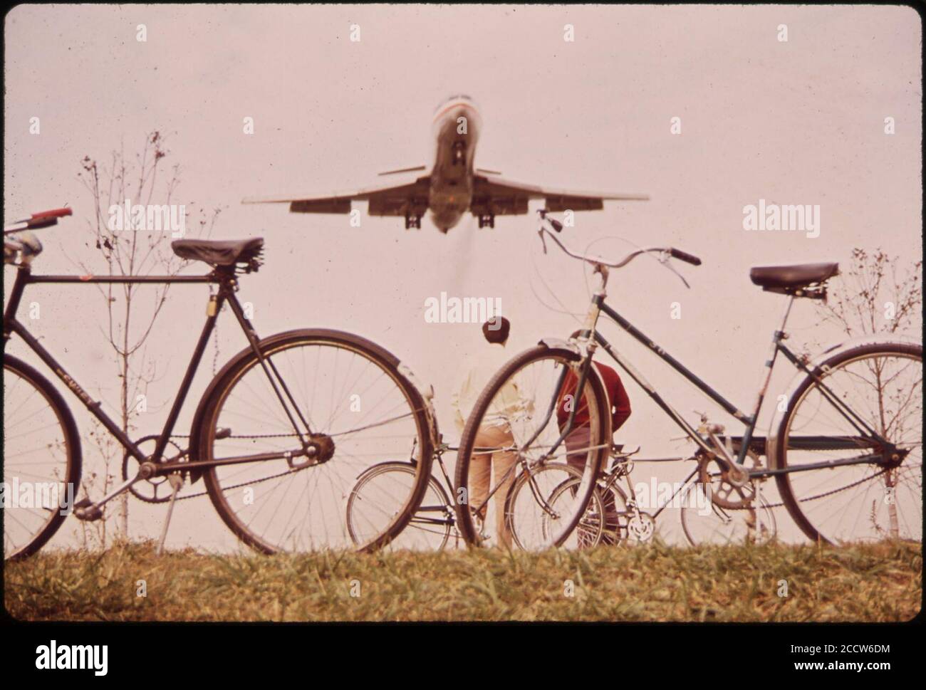 Jet Roars over Bicycle Path near Washington's Nation Airport. Noise-Decibel Level from Aircraft at This Altitude Can Cause Permanent Ear Damage. 11-1972 (3769042907). Stock Photo