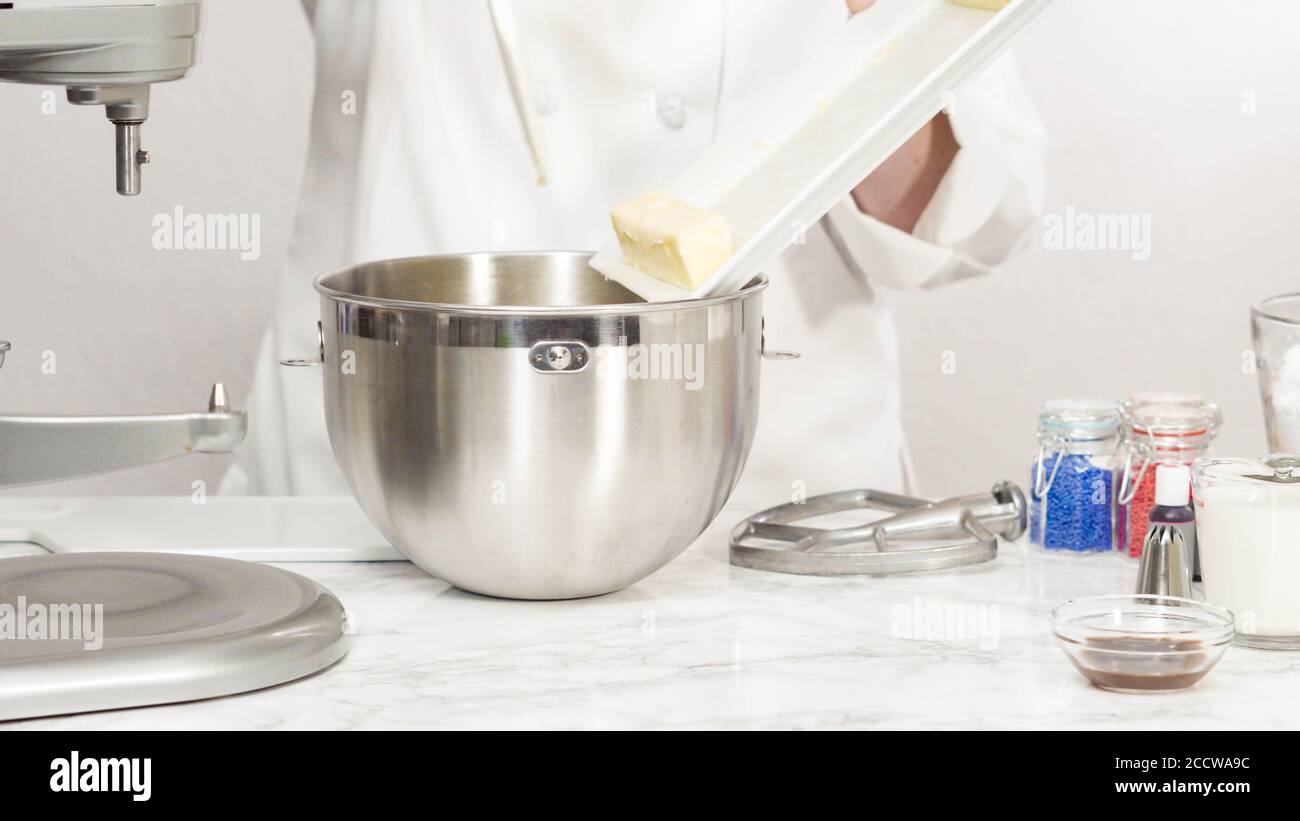 Mixing ingredients in standing kitchen mixer to make buttercream