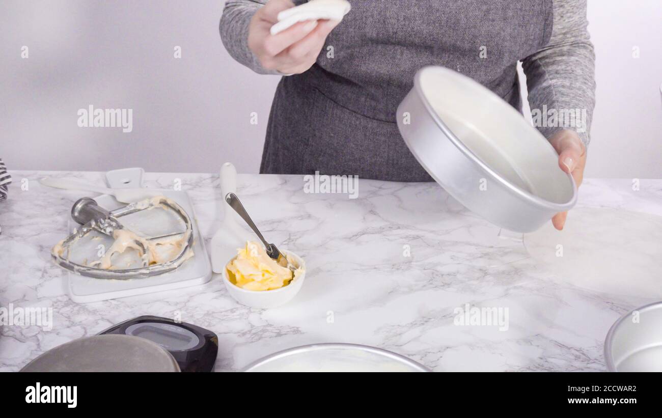 Step by step. Greasing cake pans with butter to bake funfetti cake