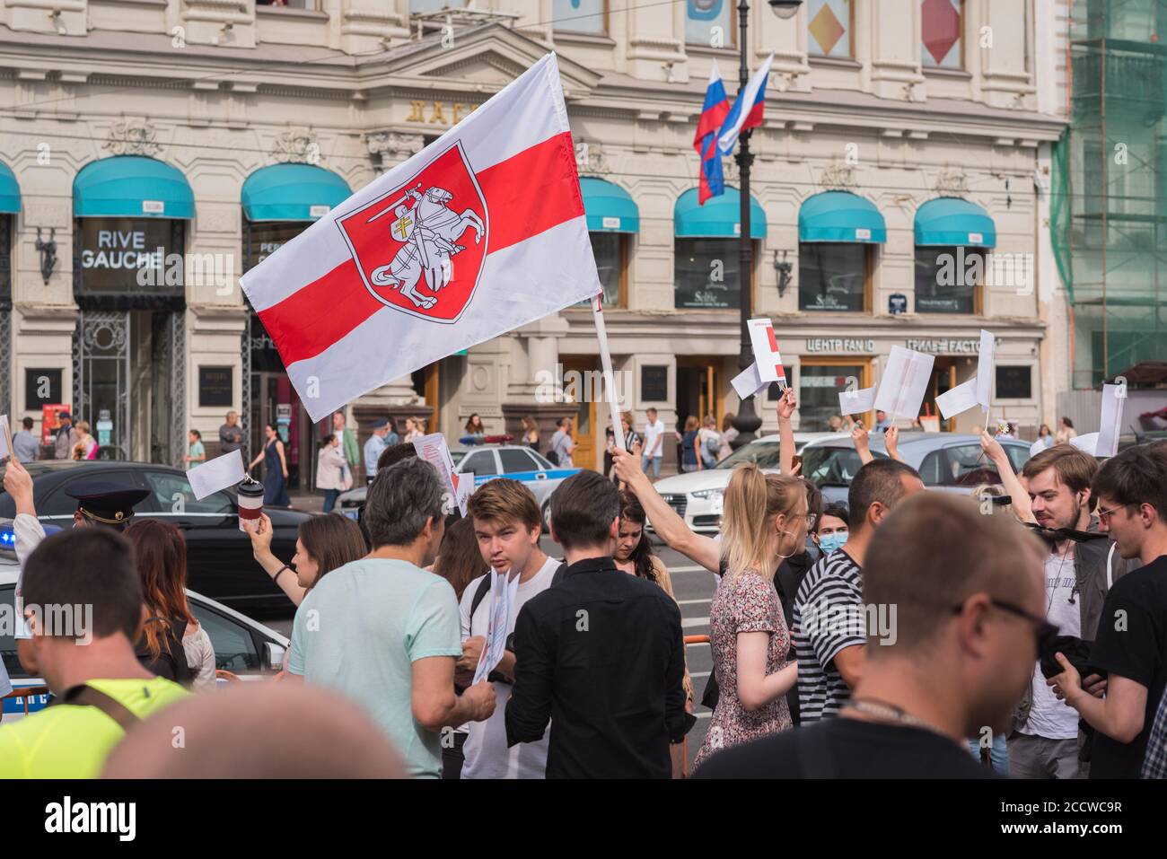 Saint Petersburg, Russia - August 22, 2020: people support democracy in Belarus waving with a white-red-white flag over Nevsky Prospect. Stock Photo