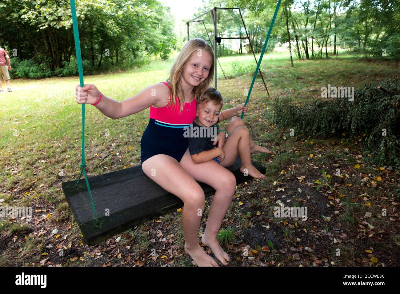 Brother and sister on a swing hi-res stock photography and images - Alamy