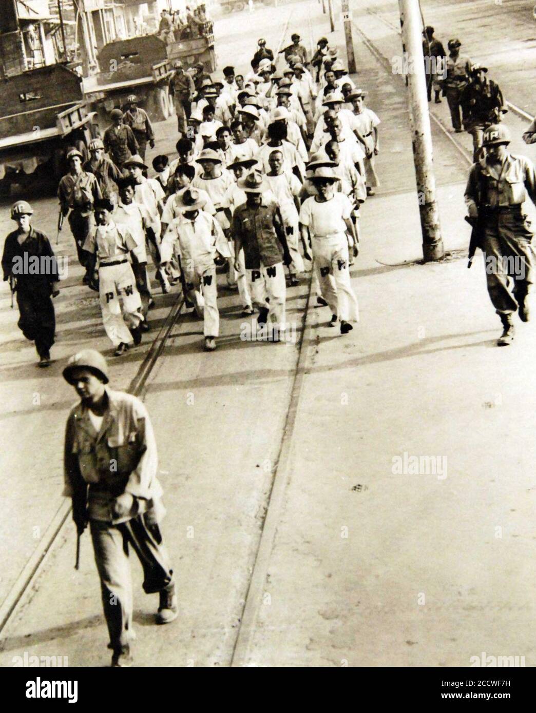 Japanese prisoners of war under direction of military police, Philippine Islands, WWII (34430148196). Stock Photo
