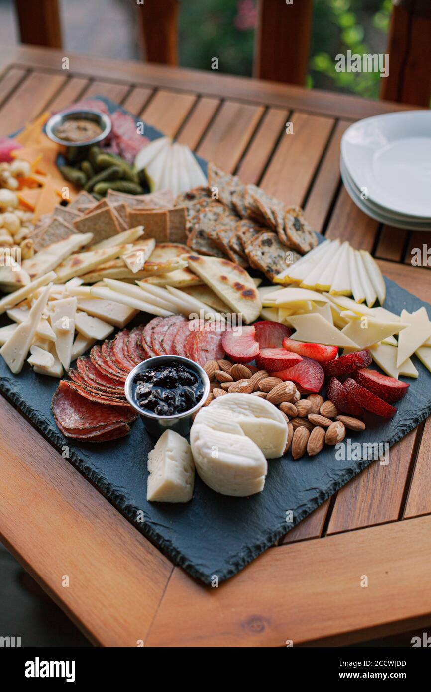 Charcuterie Board with fruit, vegetables, crackers, cheese, and dips