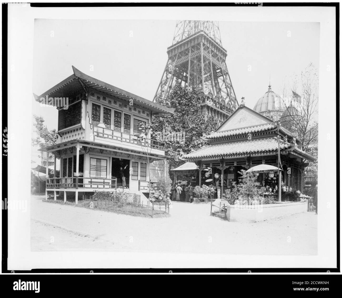 Japanese house, left, and Chinese house, right, in the History of Habitation exhibit, Paris Exposition, 1889 Stock Photo