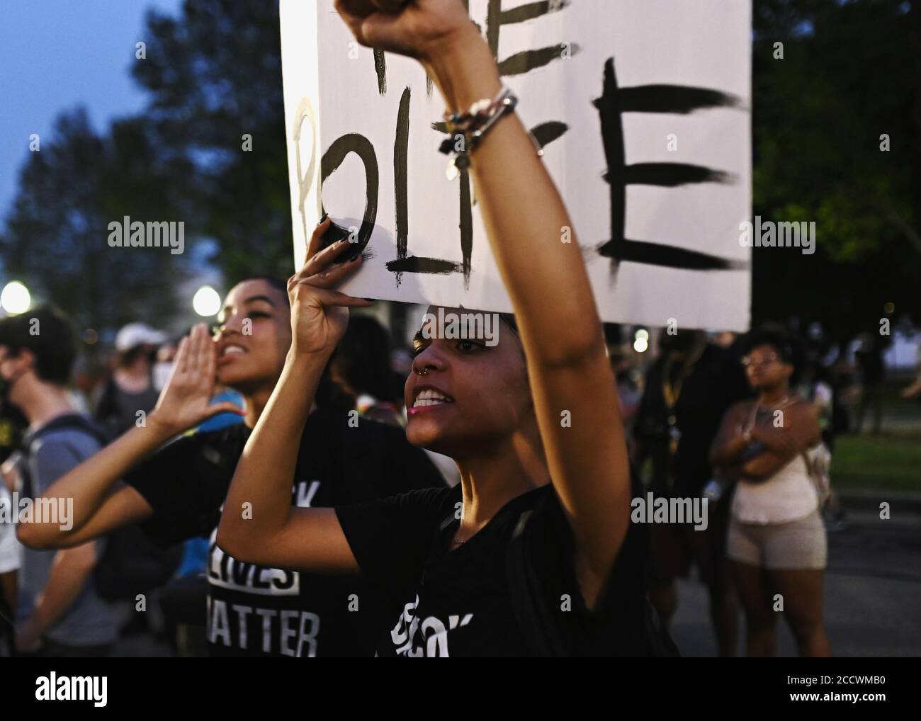 People yell at a line of police officers during a protest outside the Kenosha County Courthouse after a Black man, identified as Jacob Blake, was shot several times by police last night  in Kenosha, Wisconsin, U.S. August 24, 2020. REUTERS/Stephen Maturen Stock Photo