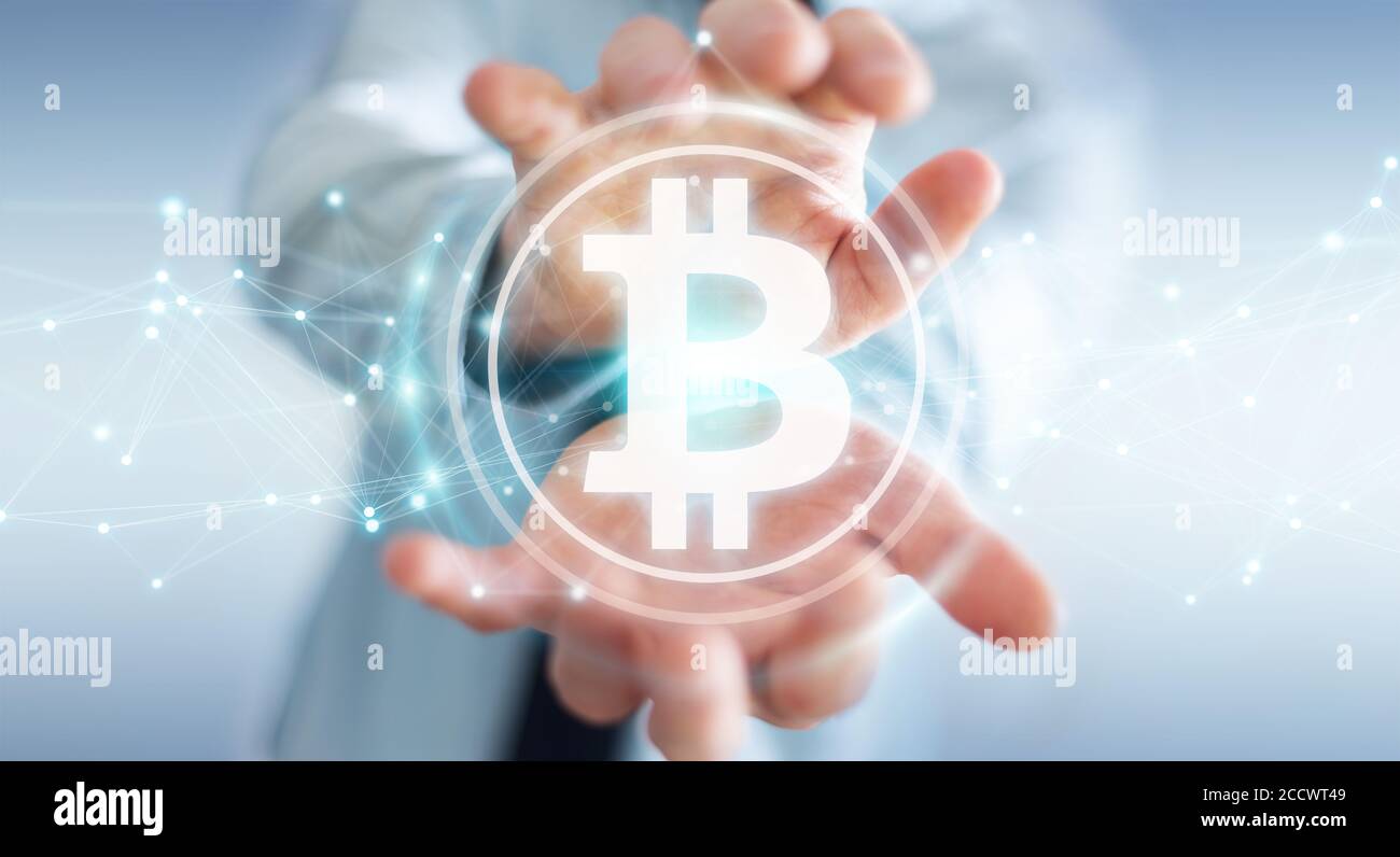 Businessman on blurred background using bitcoins cryptocurrency 3D rendering Stock Photo