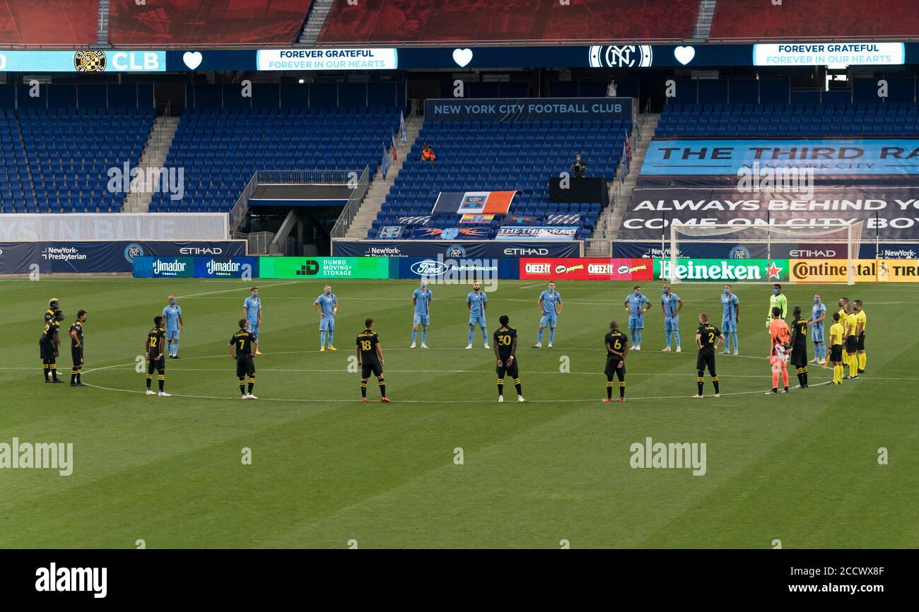 Harrison, NJ - August 24, 2020: Players of Columbus Crew SC, NYCFC and referees take moment of silence remembering victims of pandemic before MLS regular season game at Red Bull Arena Stock Photo
