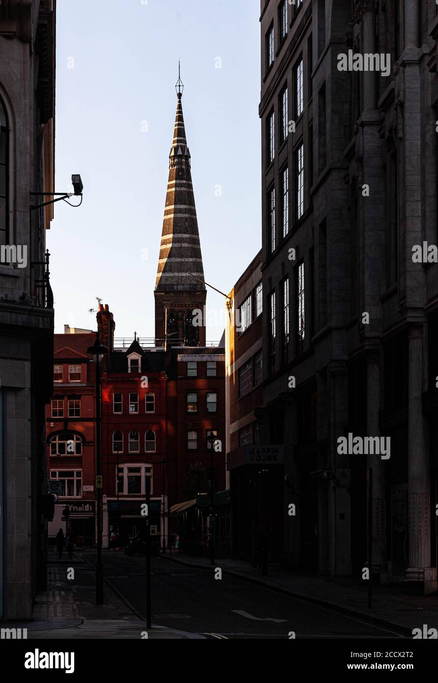 A view of the steeple of All Saints from Winsley Street, London, England, UK. Stock Photo