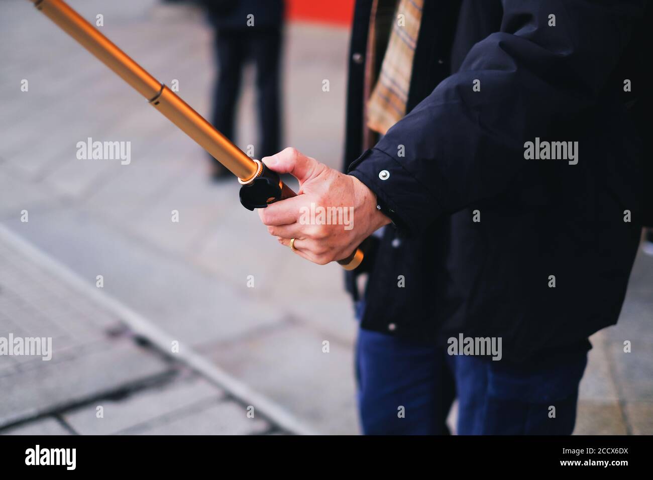 Man travel by alone and use a selfie stick for selfie himself Stock Photo