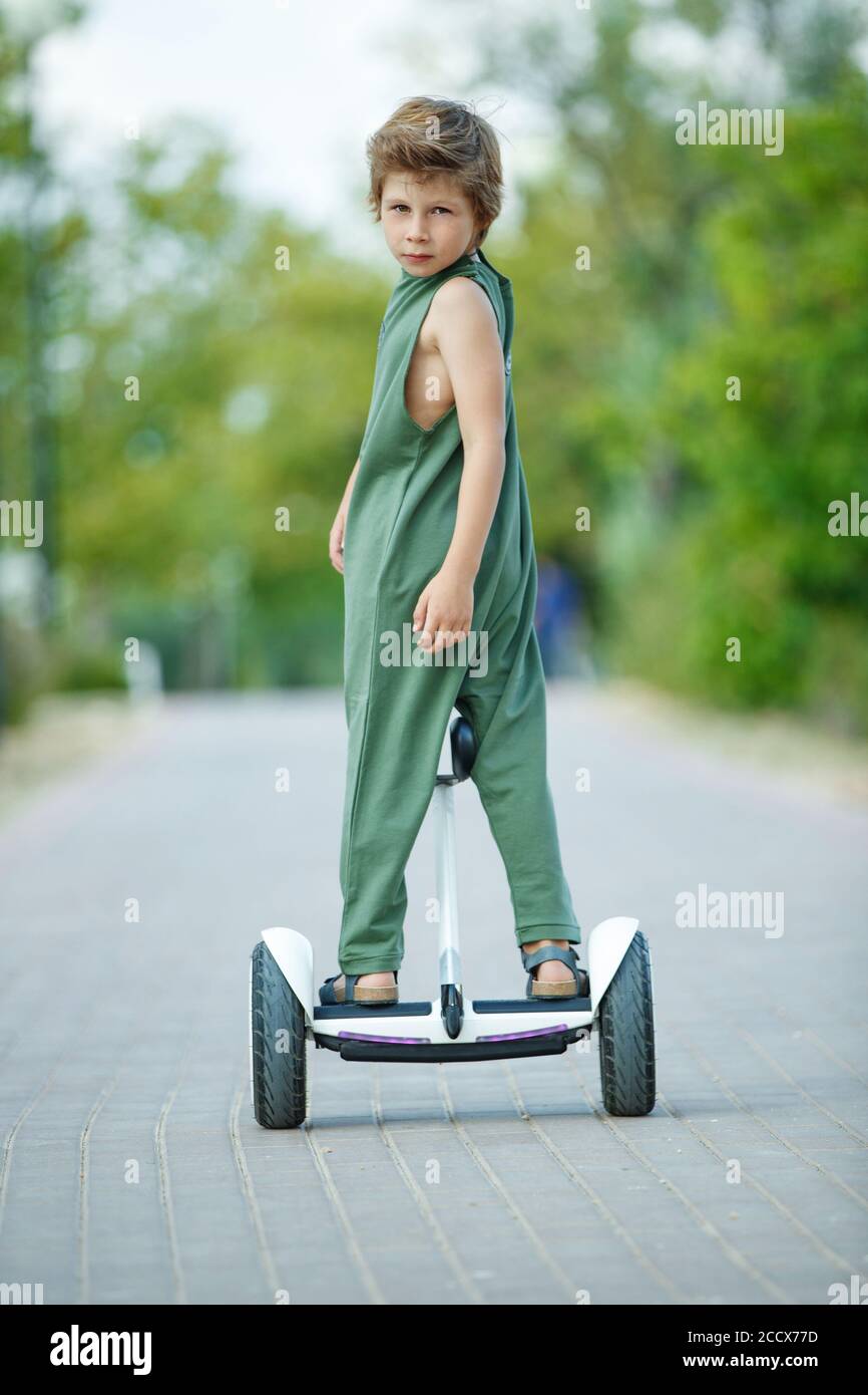 The child goes in for sports. A little boy is riding a hoverboard Stock Photo Alamy