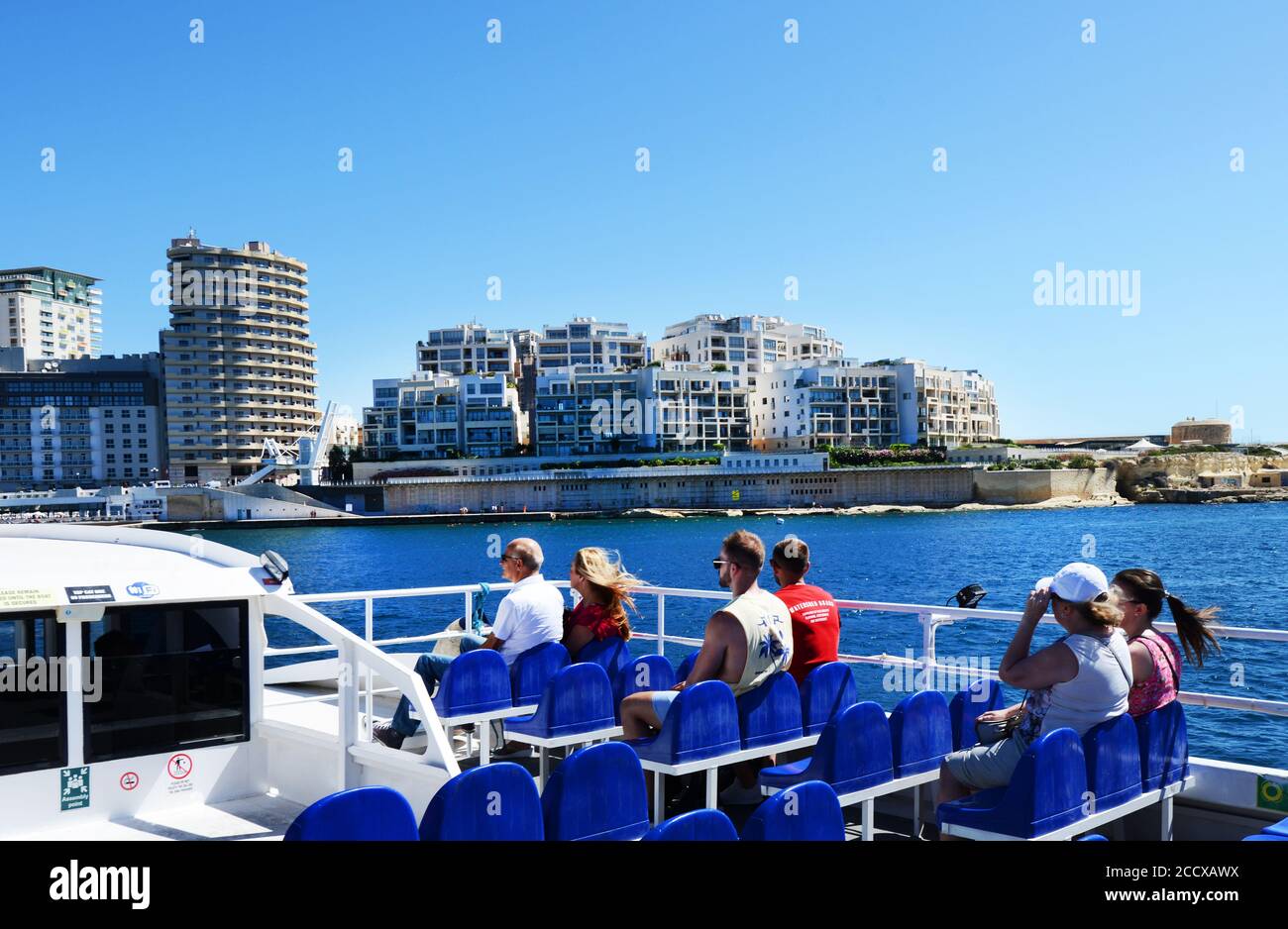 Tourist taking the boat from Valletta to Sliema in Malta. Stock Photo