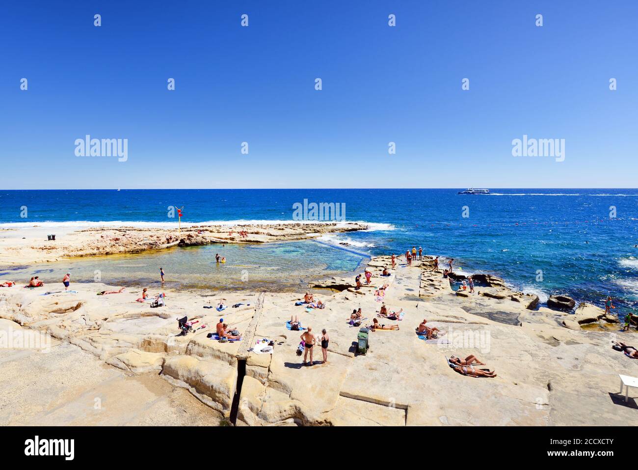 The beautiful rocky beach in Sliema, Malta. Stock Photo