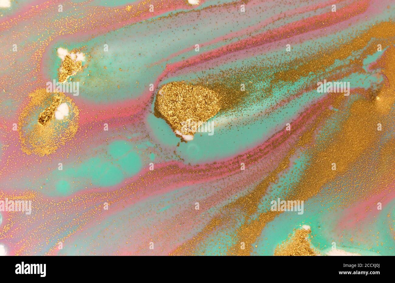 Pink Ripple Blue Pink, gold and blue mixed inks liquid ripple texture Stock Photo - Alamy