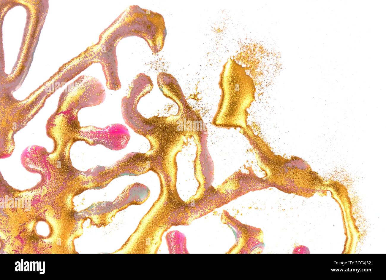 Golden ink drops and stains on white paper background Stock Photo - Alamy