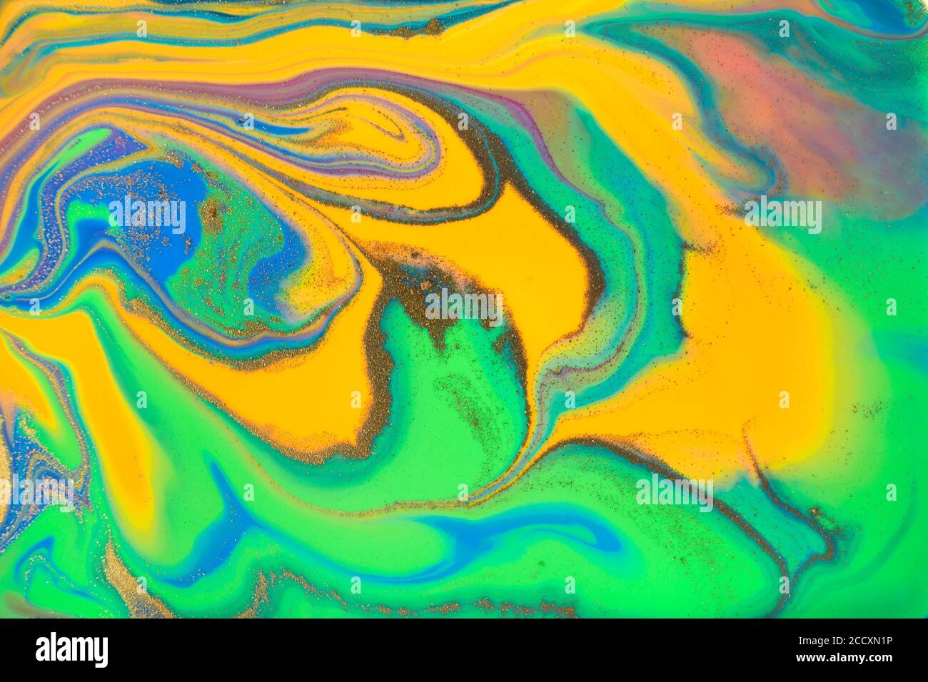 Abstract liquid ink with golden gold stains Stock Photo - Alamy