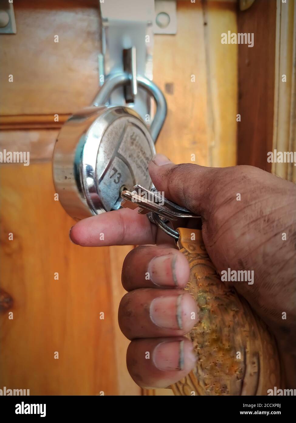 Worker Open Unlock The Door Lock With Holding In Key In Dirty Hand Stock Photo Alamy
